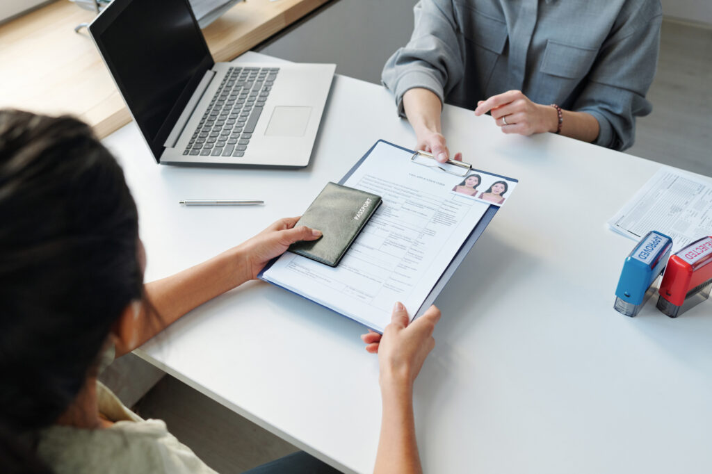 Spouse of a foreign national prepares to apply online for an open work permit as a dependent spouse, ensuring they maintain valid status while residing in Canada.