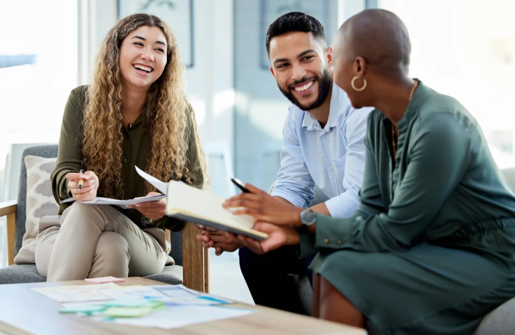 Smiling entrepreneur reviewing work permit application documents for Canada’s C11 program