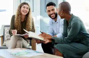 Smiling entrepreneur reviewing work permit application documents for Canada’s C11 program