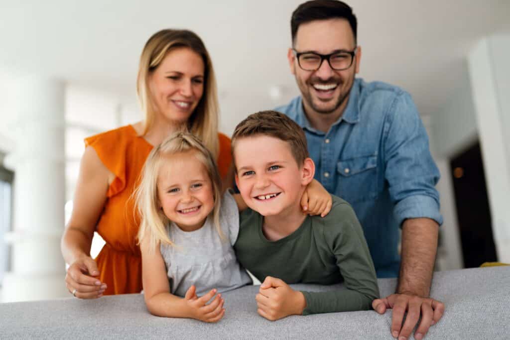Happy family of successful C11 work permit holders enjoying life in Canada after establishing their business and achieving permanent residency