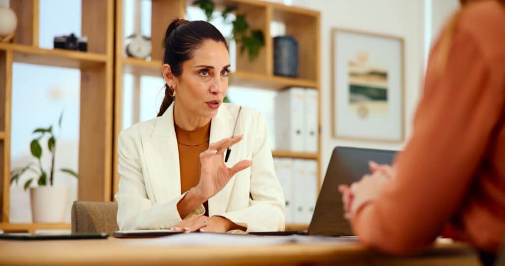 Business owner reviewing an IRCC refusal letter with an immigration lawyer in Toronto