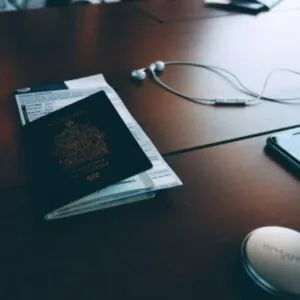 passport and corresponding documents sitting on a desk